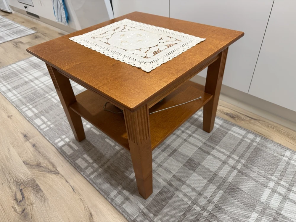 The coffee table in the original corner-view photograph.